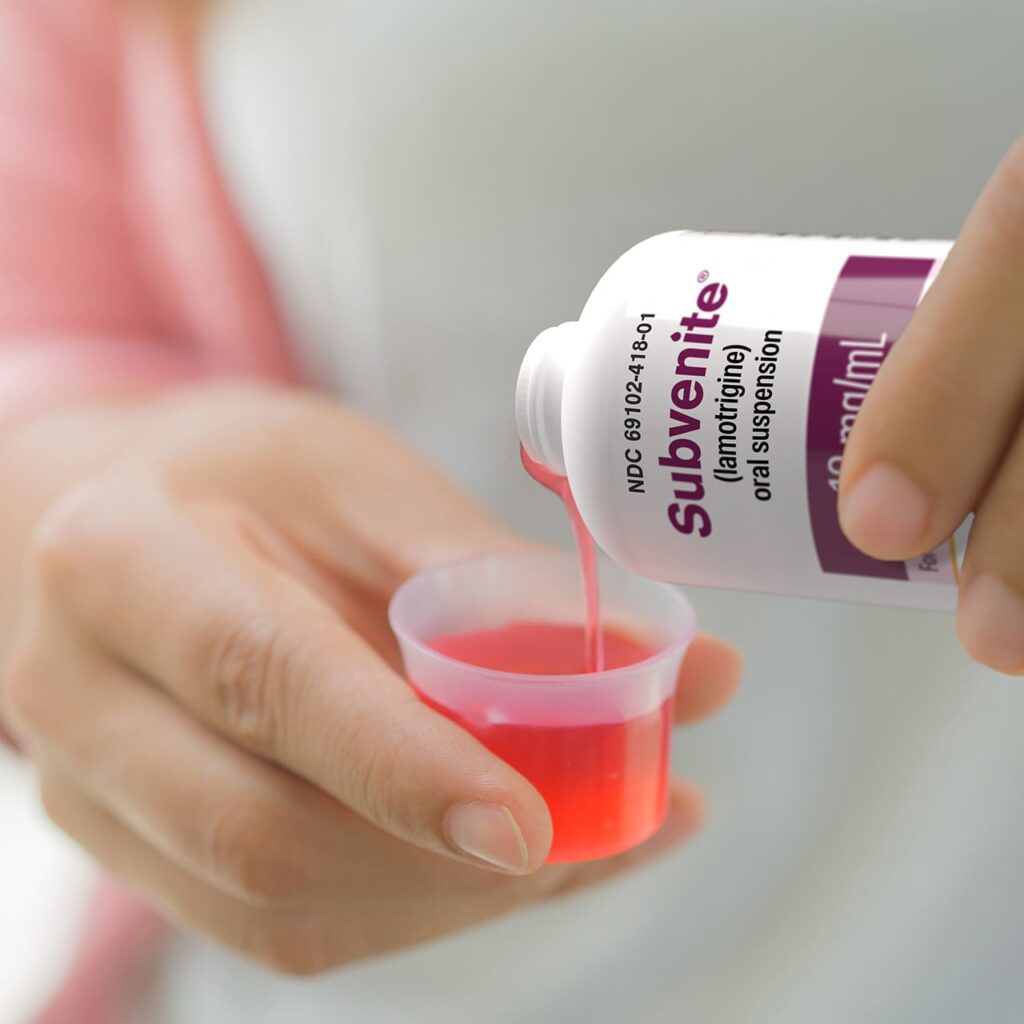 woman pouring subvenite into dosing cup
